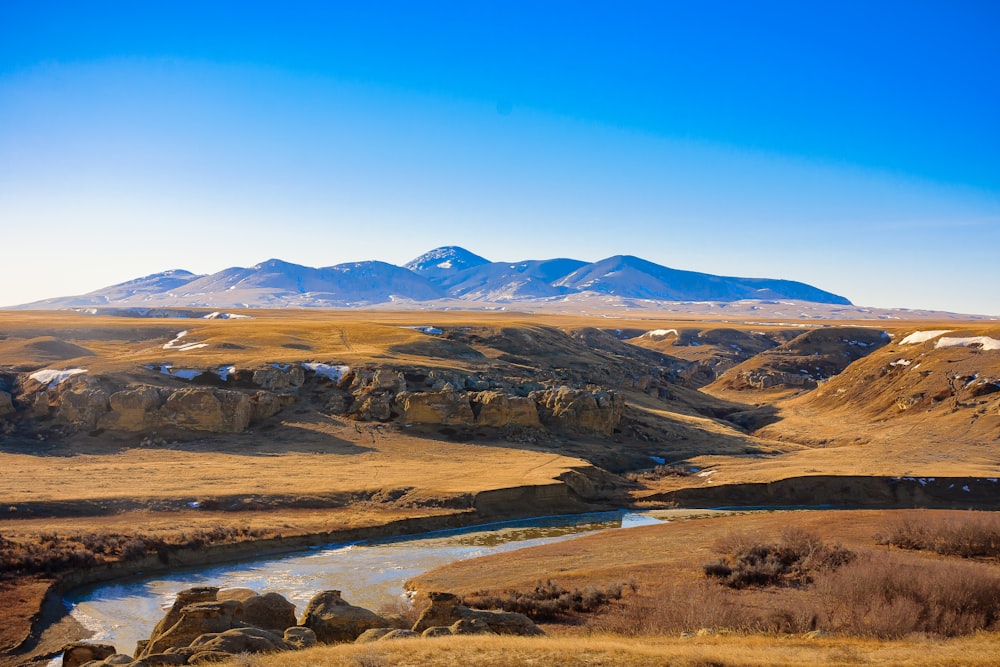 brown mountains under blue sky during daytime