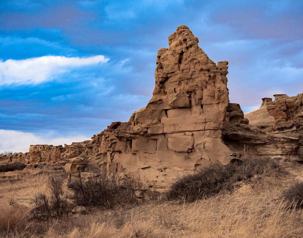 brown rock formation under blue sky during daytime