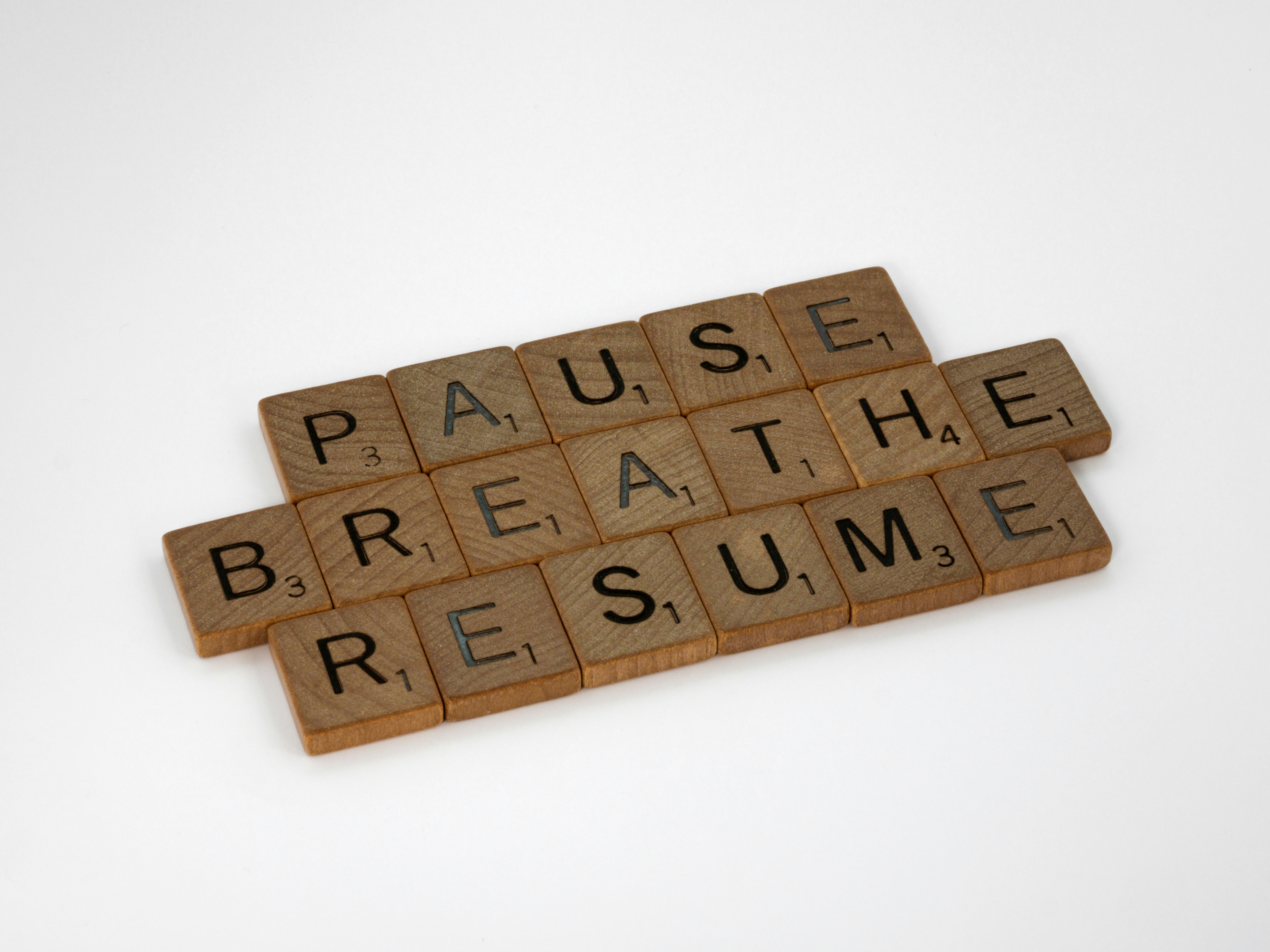 scrabble, scrabble pieces, lettering, letters, wood, scrabble tiles, white background, words, quote, letters, type, typography, design, layout, focus, bokeh, blur, photography, images, image, pause, breathe, resume, pause breathe dream, rest, stop, think, mindfulness, don't rush, focus, reset, redux, reboot, perspective, pace yourself, pace, balance, relax, 