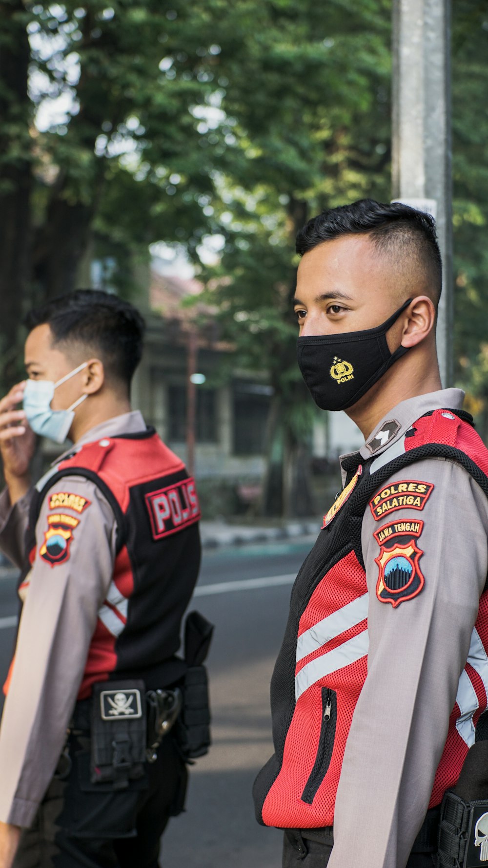 man in black and red jacket wearing black mask