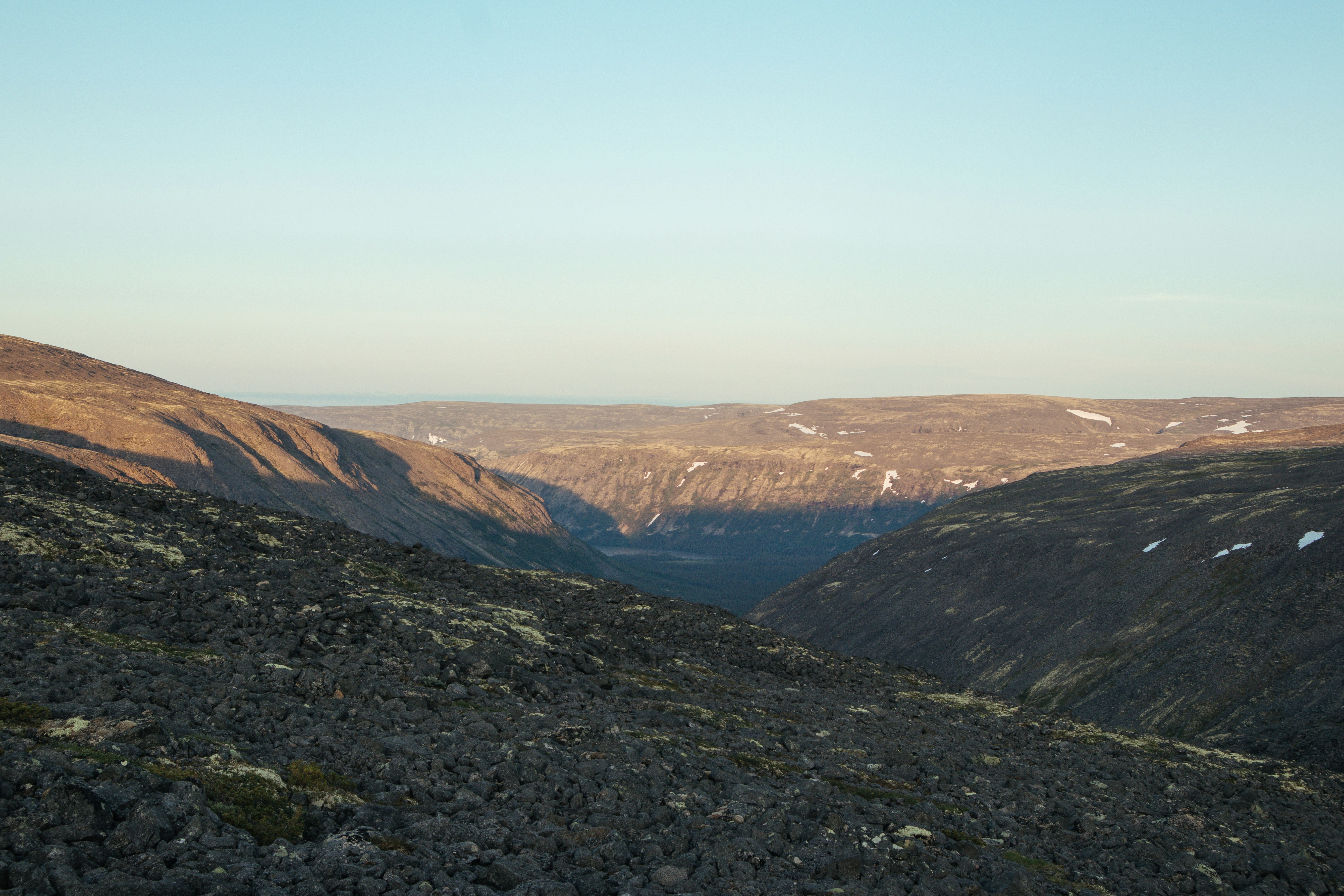 brown and green mountains under white sky during daytime