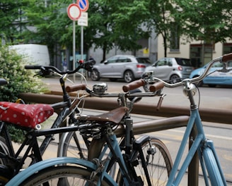 blue and black bicycle parked on sidewalk during daytime