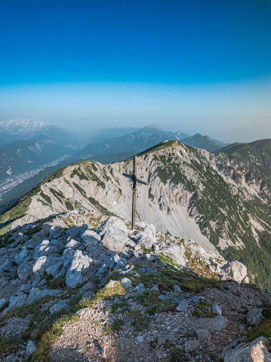 gray rocky mountain under blue sky during daytime in Hochstuhl Slovenia