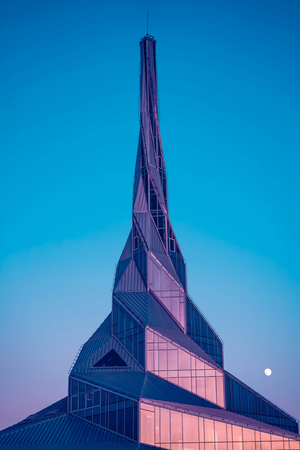 black and gray concrete building under blue sky