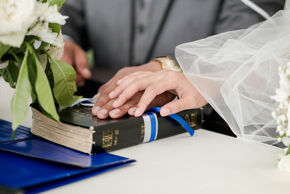 person holding blue and white box