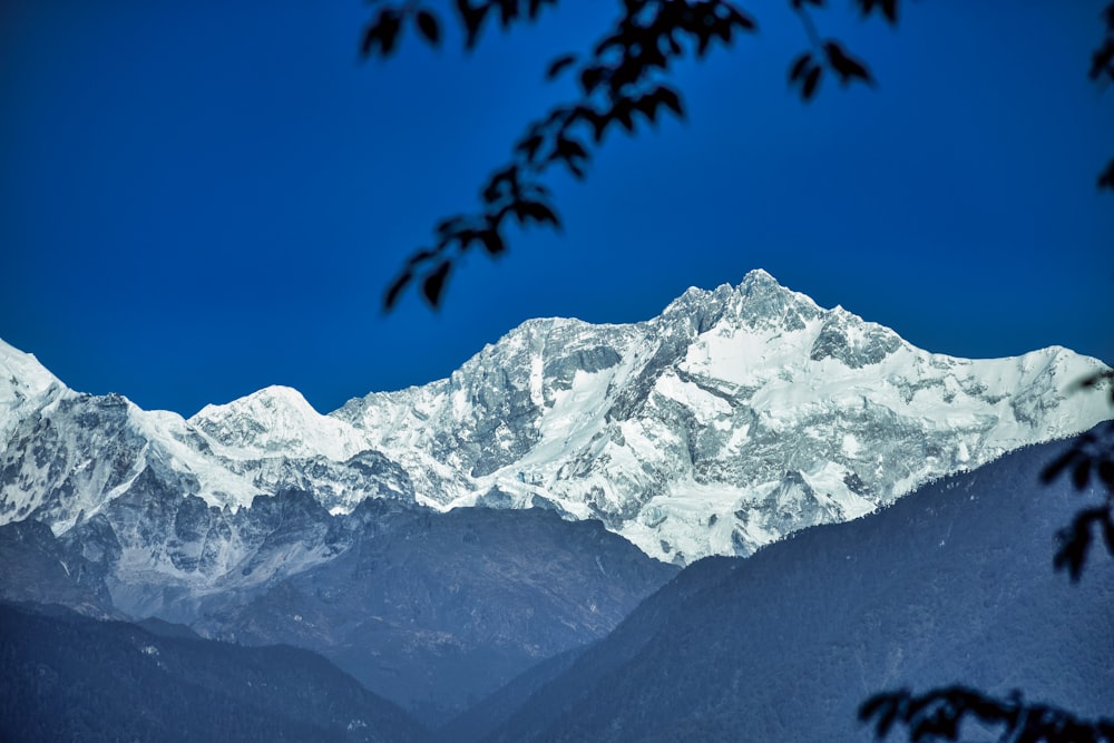 snow covered mountain under blue sky during daytime