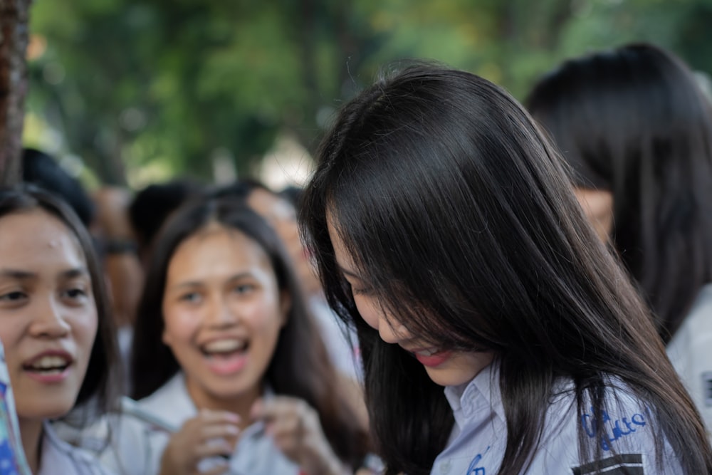 woman in white shirt smiling