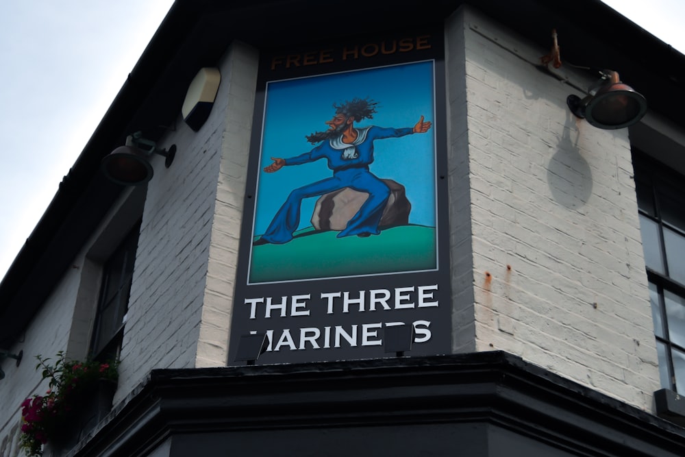 a sign on the side of a building that says the three marine's