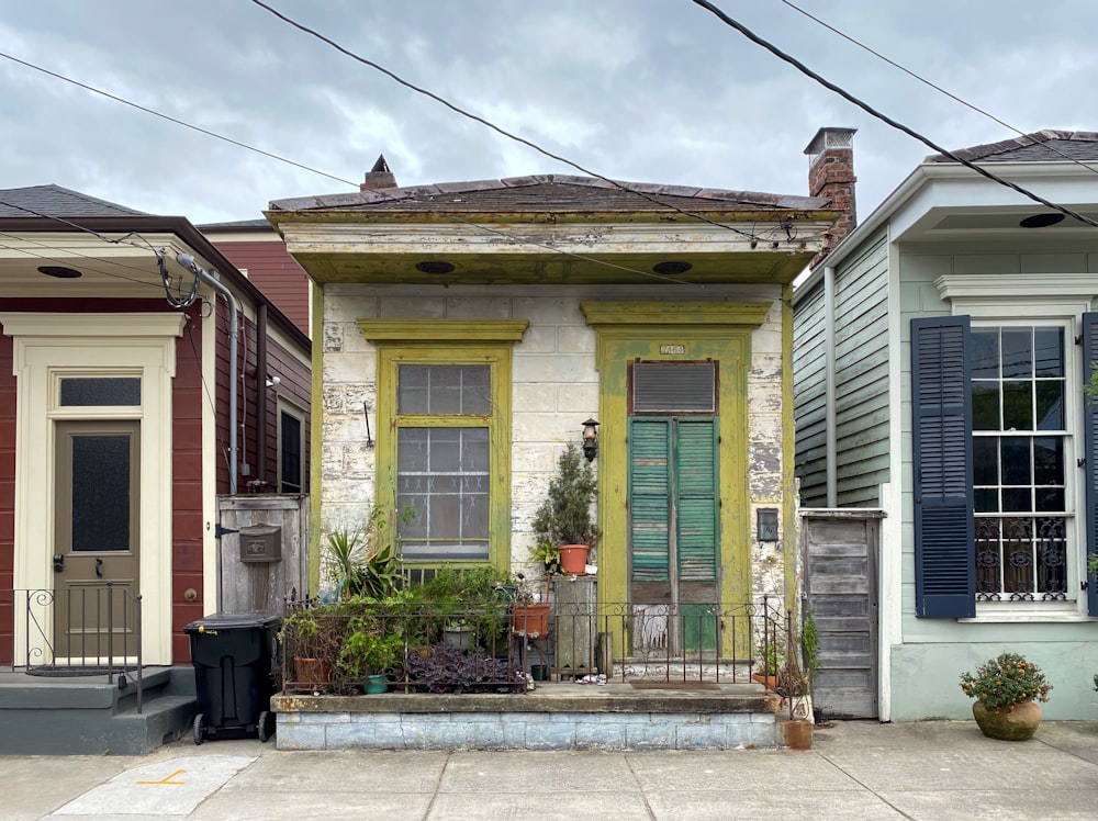 yellow and white wooden house under blue sky during daytime