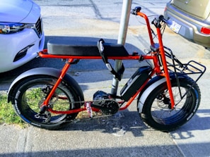 An electric bike parked in a modern urban environment.