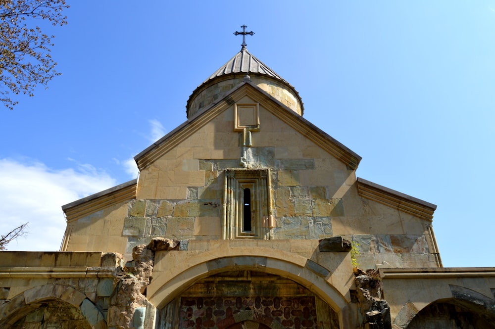 brown concrete church under blue sky during daytime