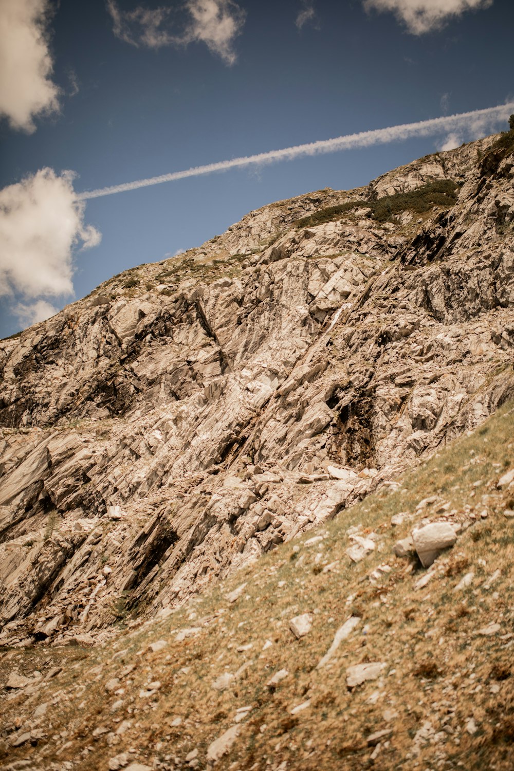 brown rocky mountain under blue sky during daytime