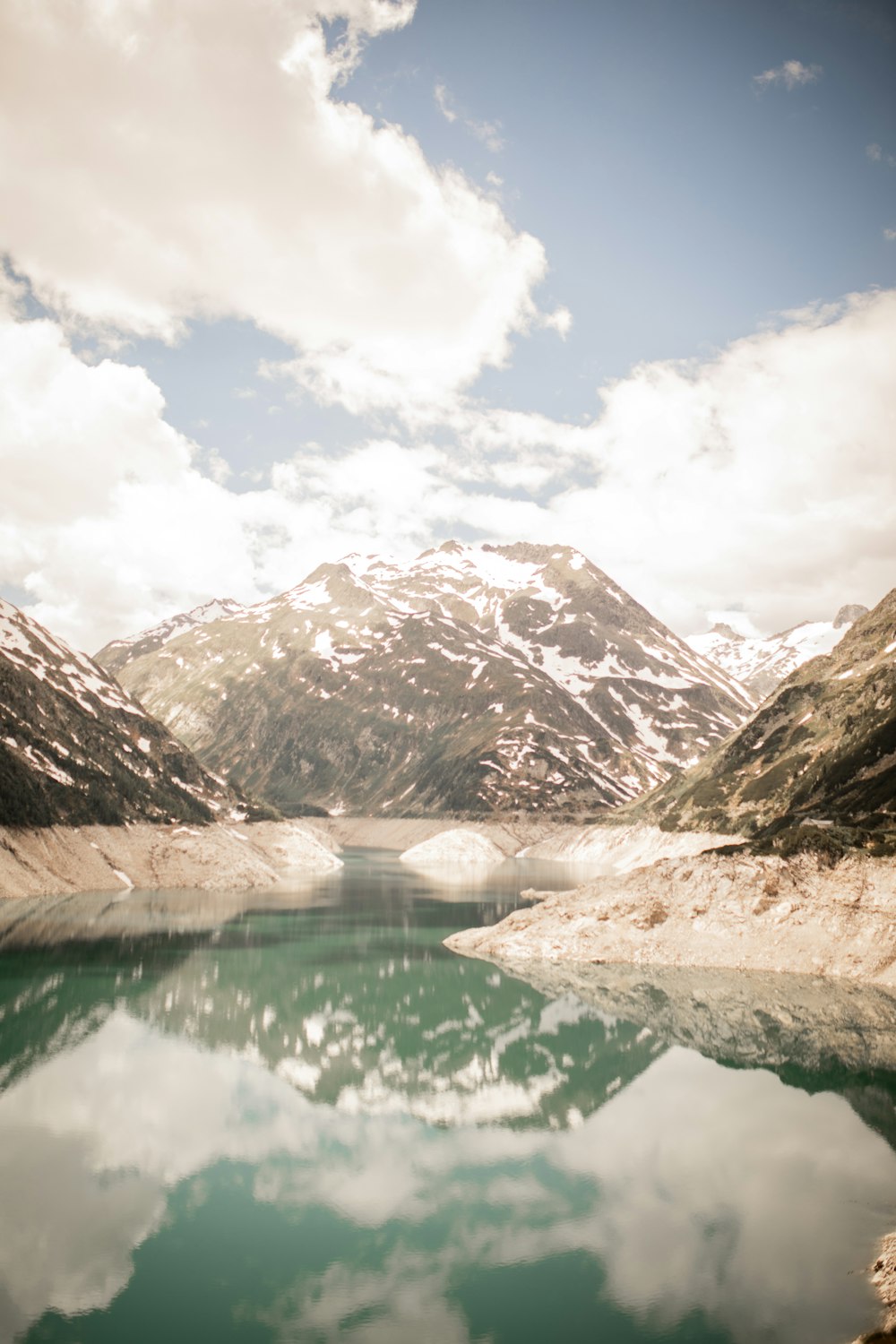 lake in the middle of mountains