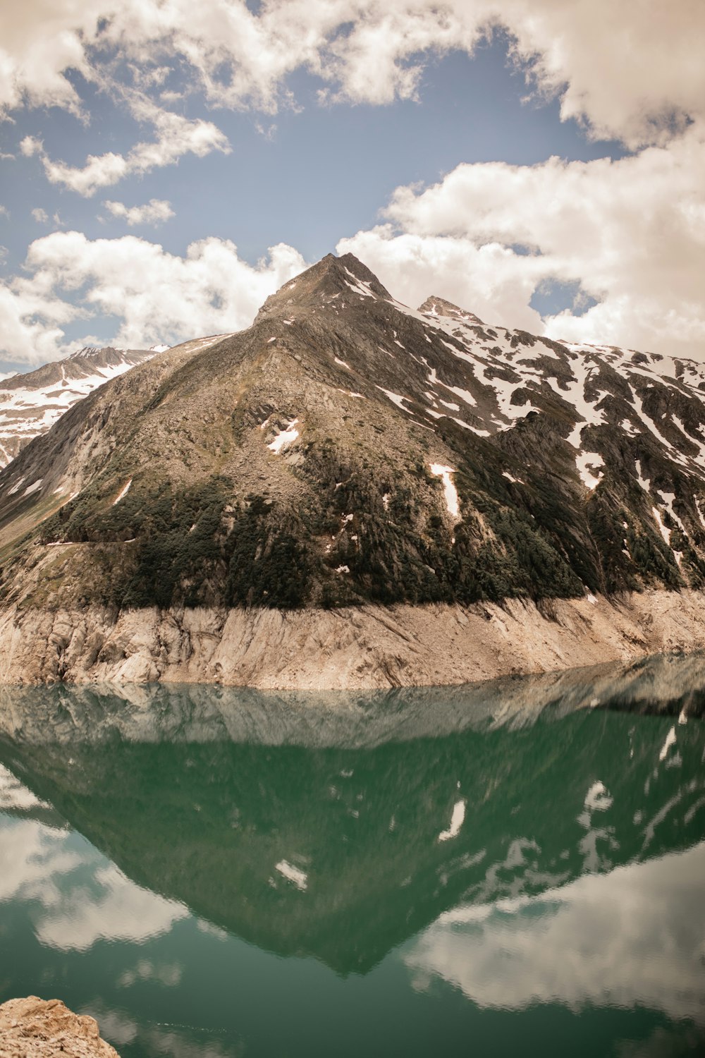 brown and white mountain under blue sky during daytime