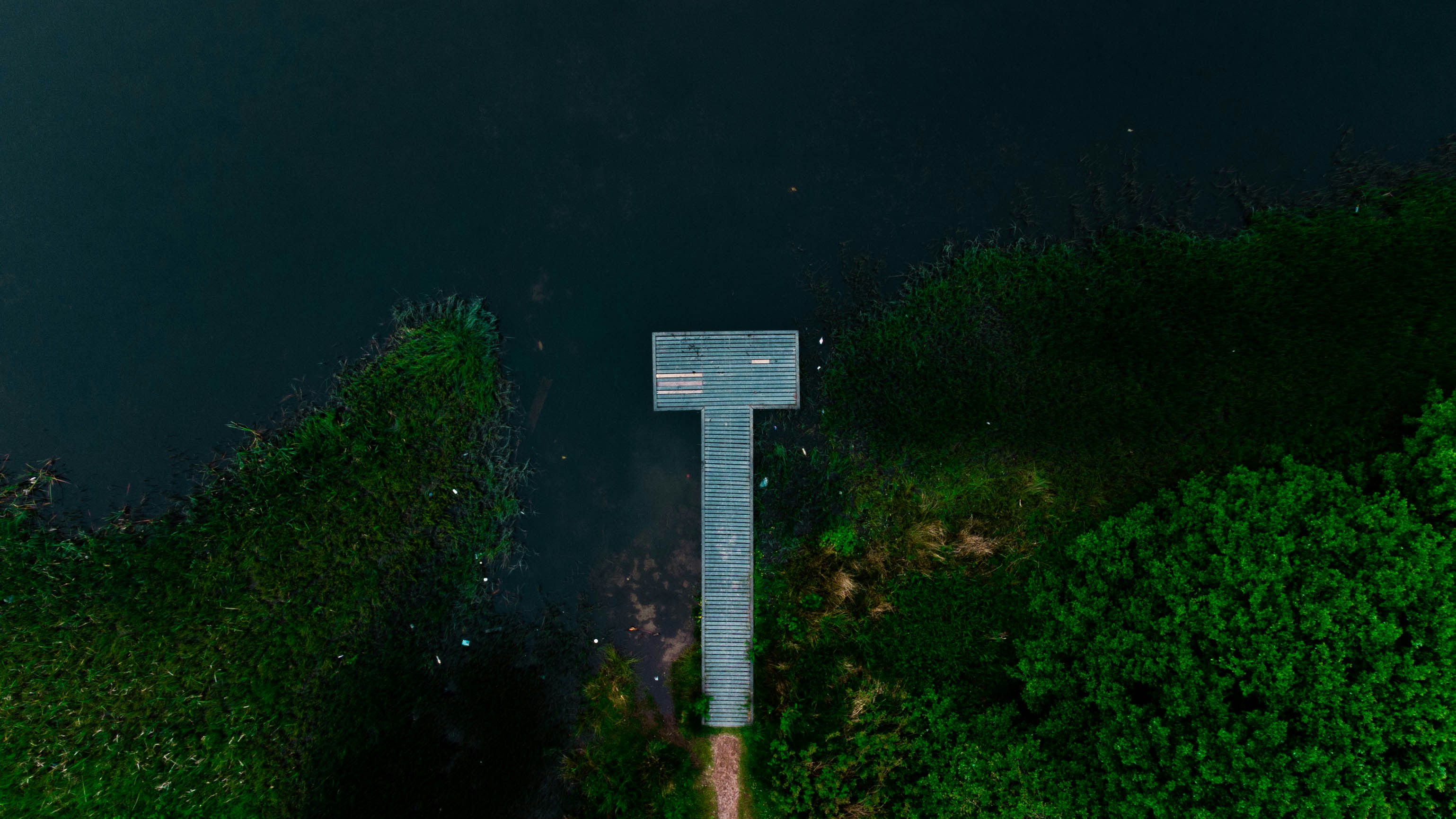 white and black cross on green grass during nighttime