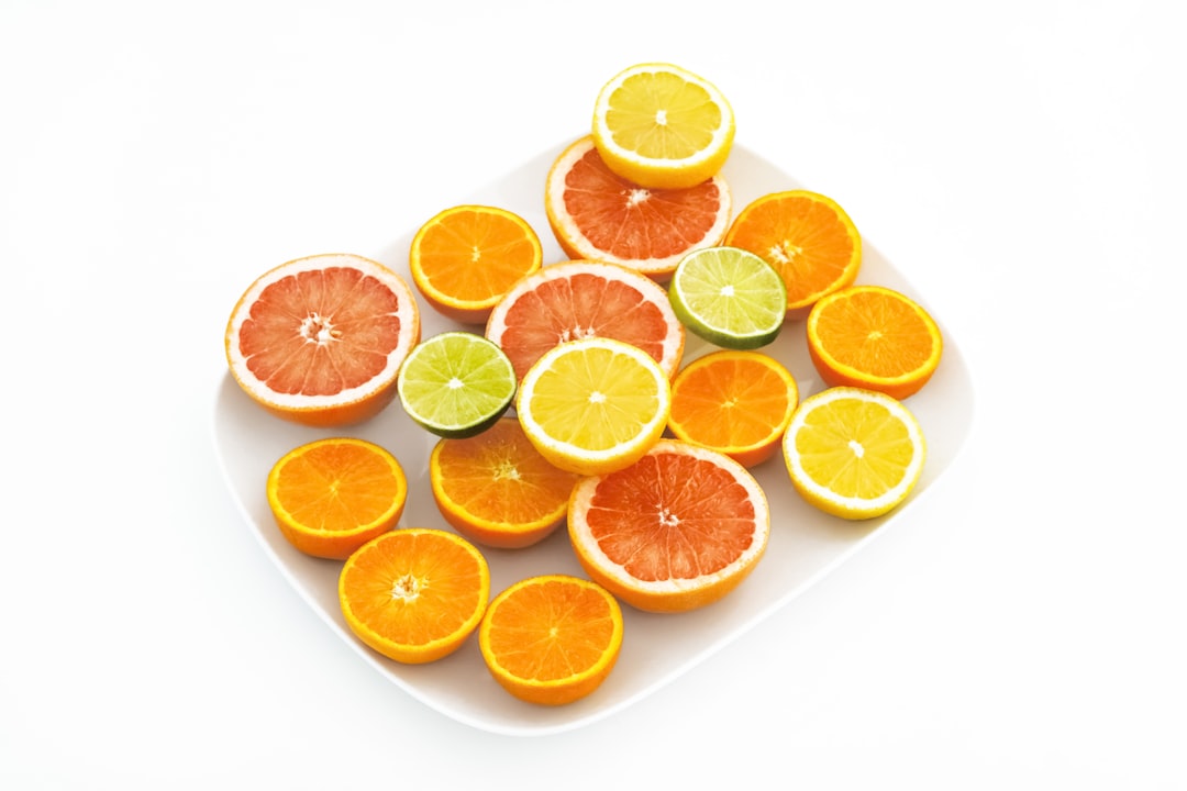 sliced orange fruit on white surface