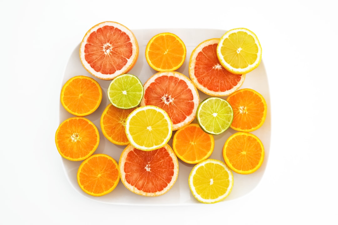 sliced orange fruit on white background