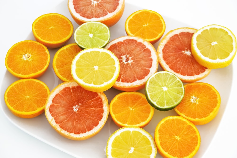 sliced orange fruit on white surface