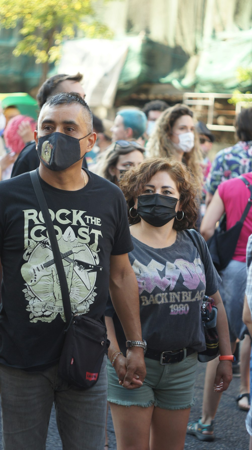 man in black crew neck t-shirt wearing black sunglasses