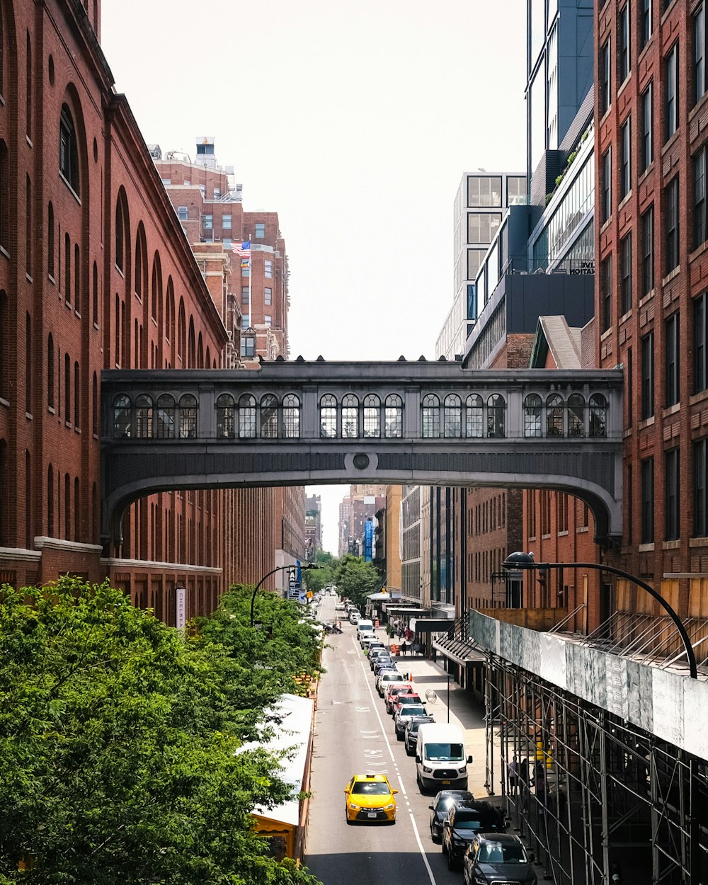 brown concrete building near bridge during daytime