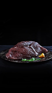 raw meat on black plate