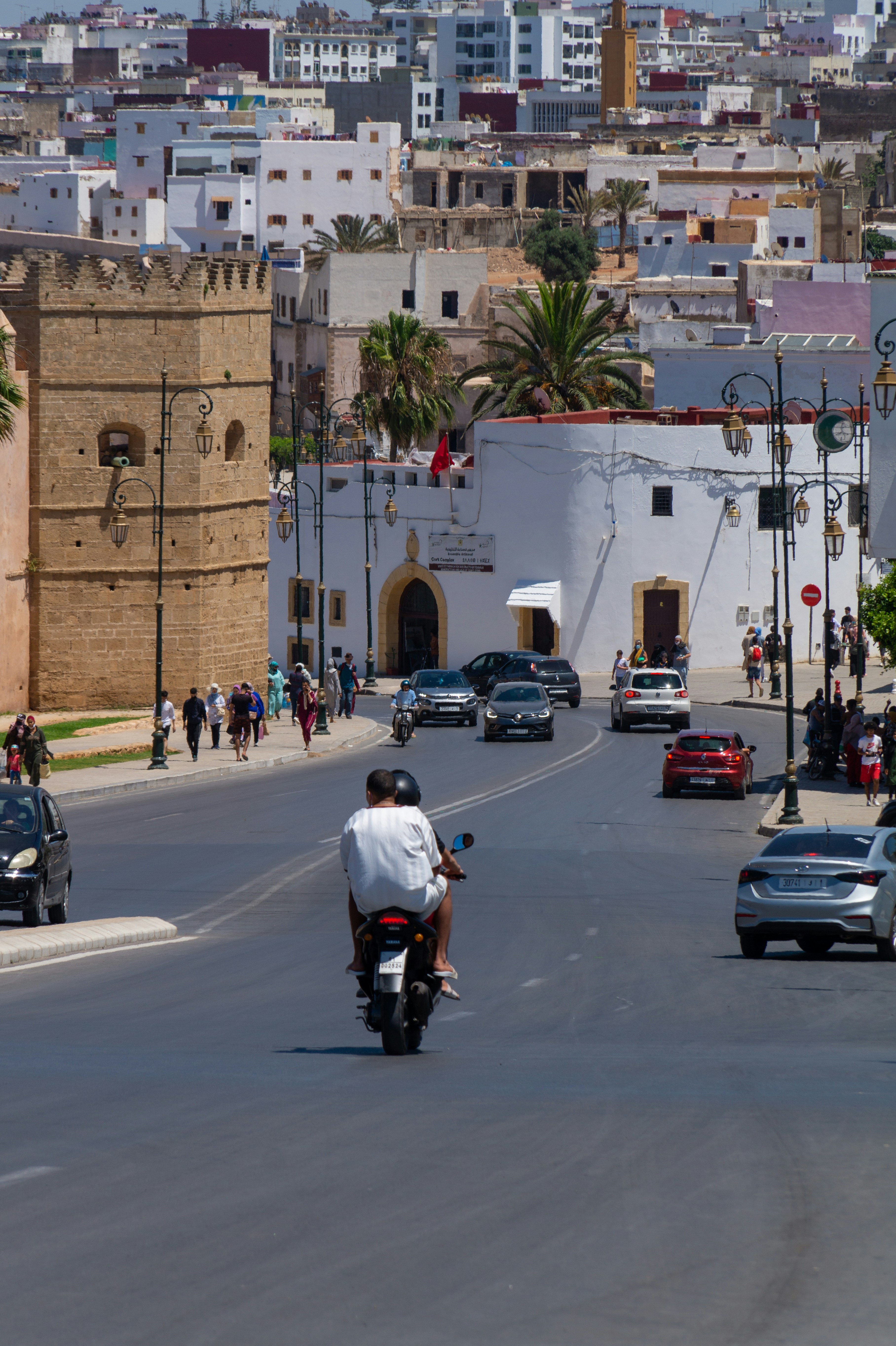 people riding motorcycle on road during daytime