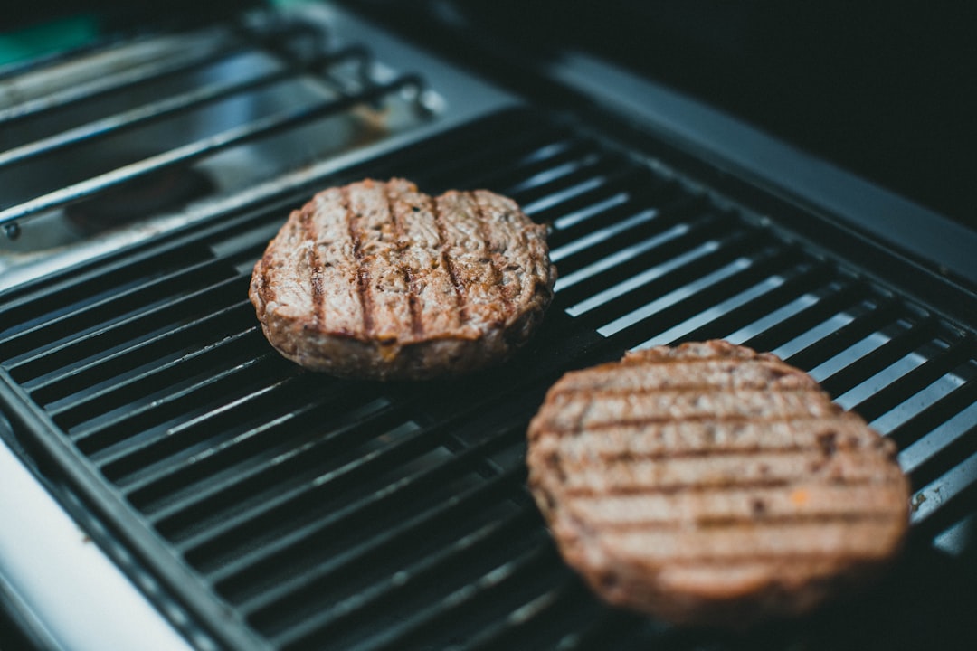 2 brown cookies on black grill