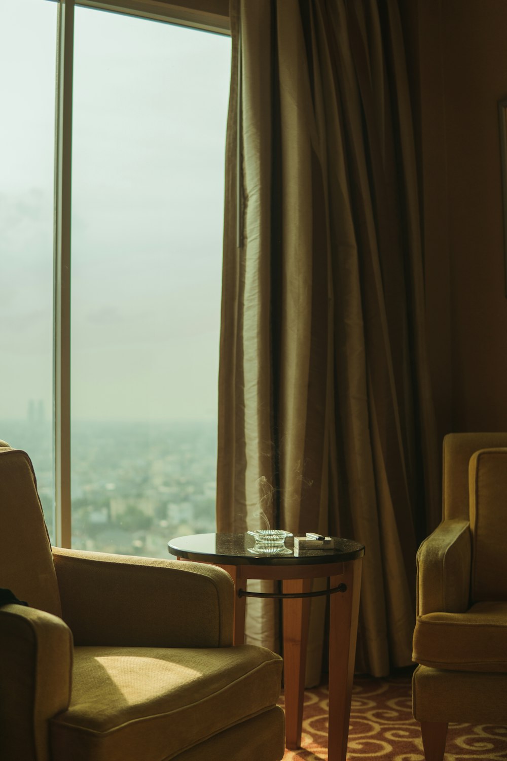 brown wooden table near window