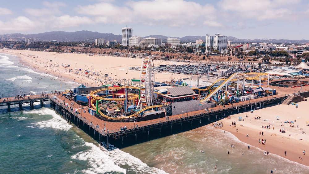 people on beach near city buildings during daytime