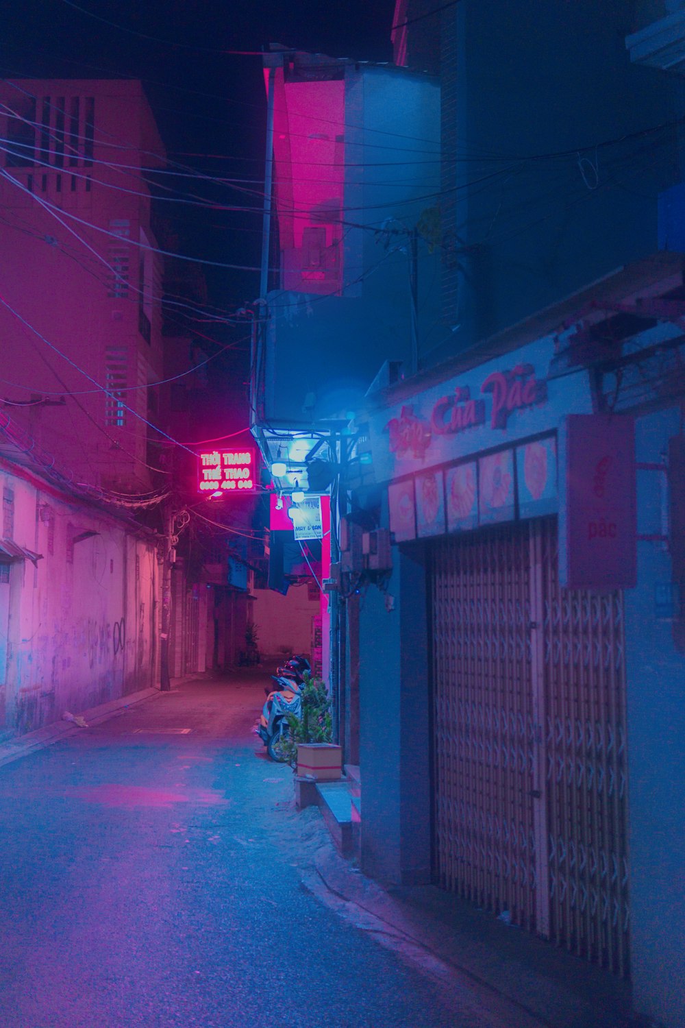 man in black jacket walking on street during nighttime