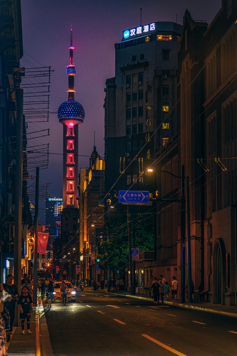 people walking on street during night time