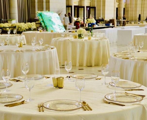 clear wine glasses on table in a banquet hall maintained by cleaning services in markham