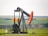 black and orange metal machine on green grass field during daytime