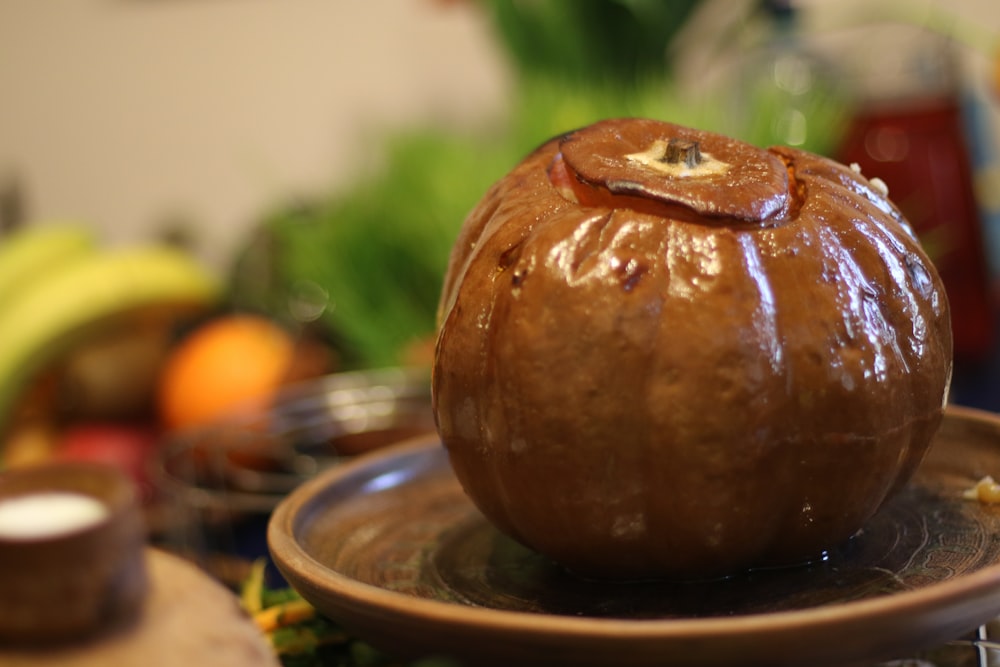 brown round fruit on blue ceramic plate