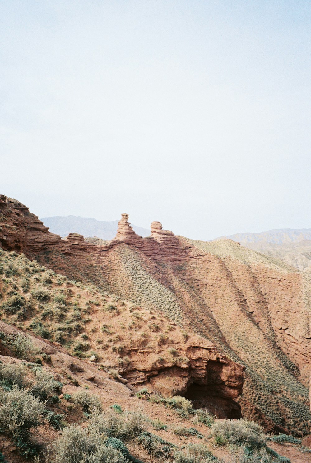 brown rock formation under white sky during daytime