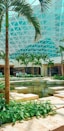green palm trees near fountain