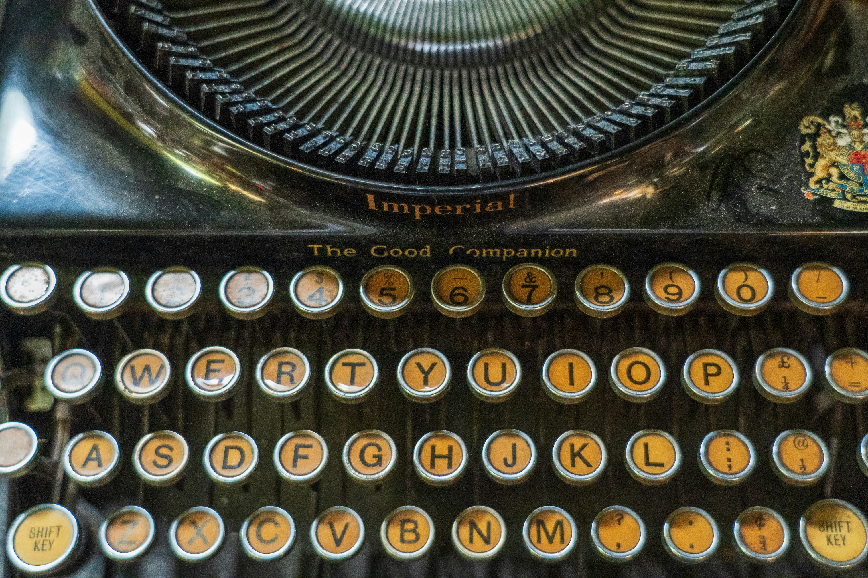 black and white typewriter on brown wooden table