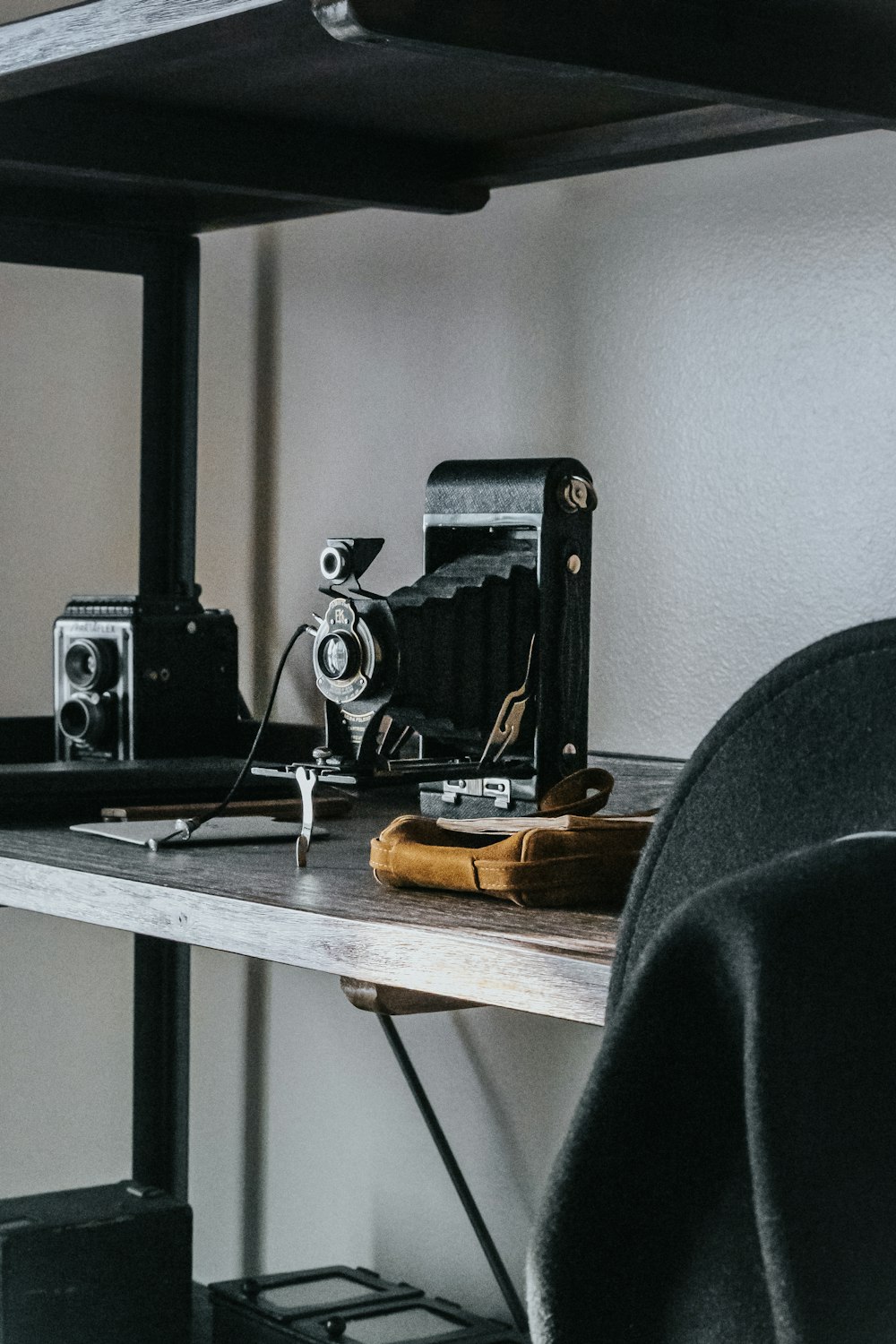 black speaker on brown wooden table