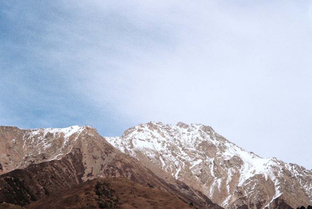 snow covered mountain under blue sky during daytime