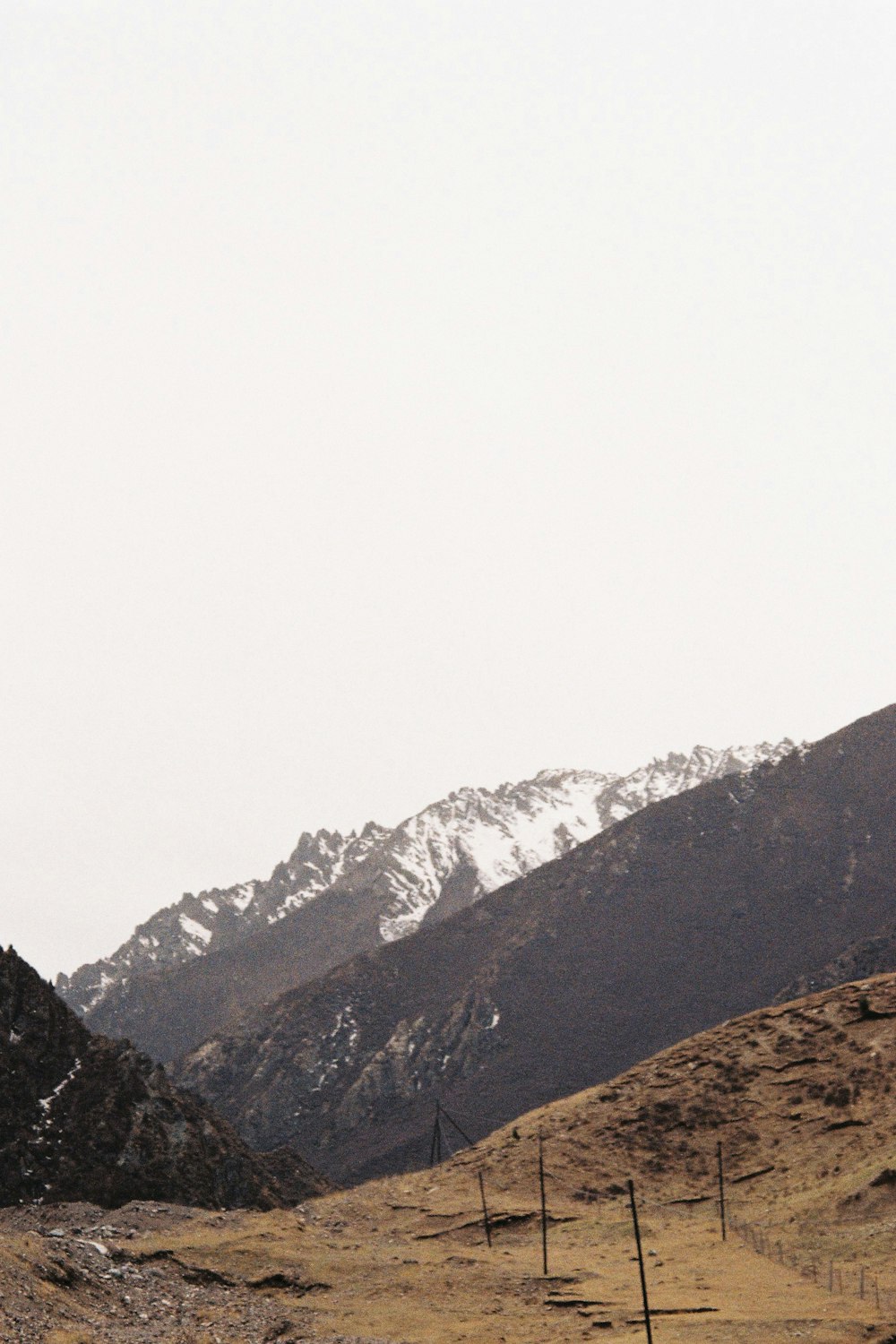 black and white mountains under white sky during daytime