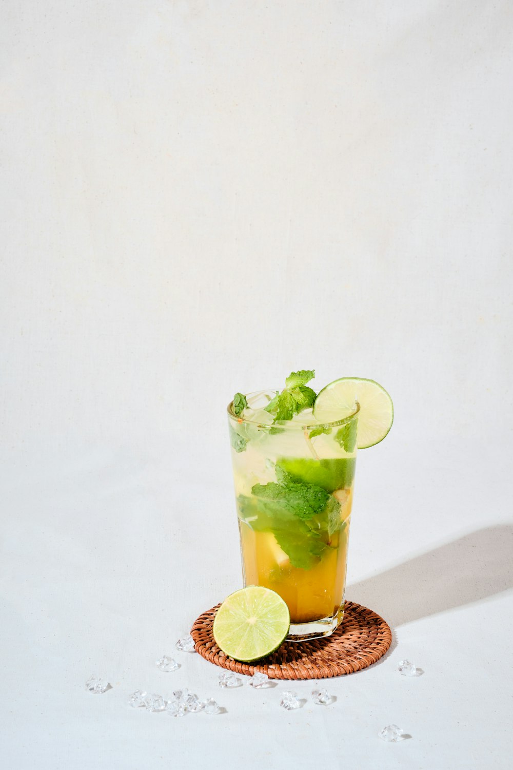 green and white ice cream in clear drinking glass