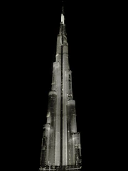 A sleek 3D rendering of a modern building glowing softly against a dark background, highlighting intricate architectural details.