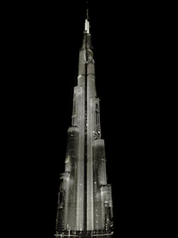 A stunning digital visualization of a modern real estate development illuminated at night, set on a pure black backdrop.