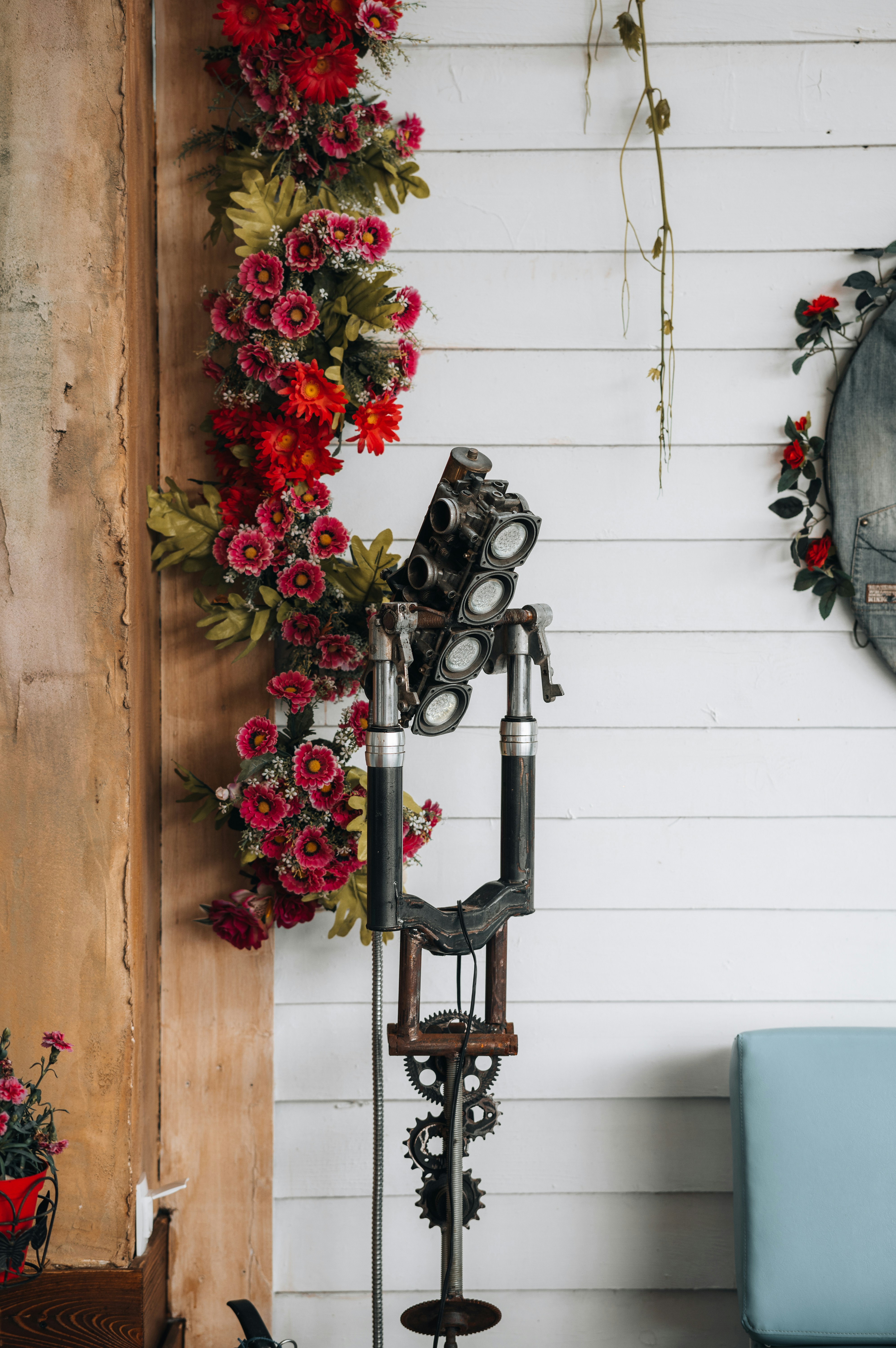 red flowers on black metal rack