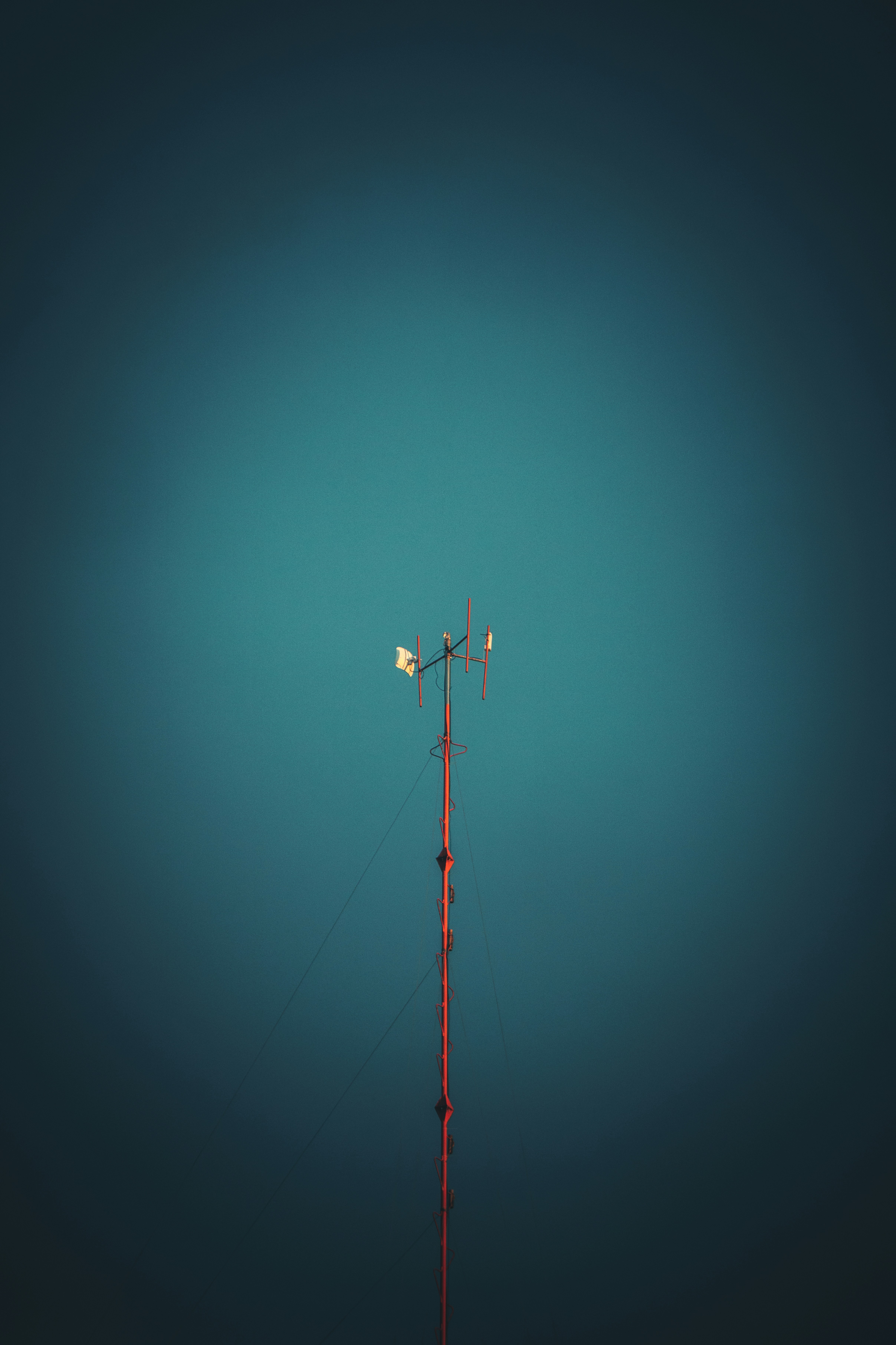 black and red metal pole under blue sky