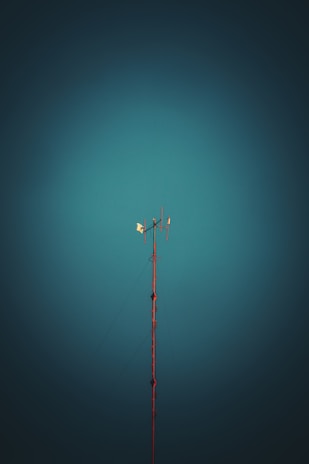 black and red metal pole under blue sky