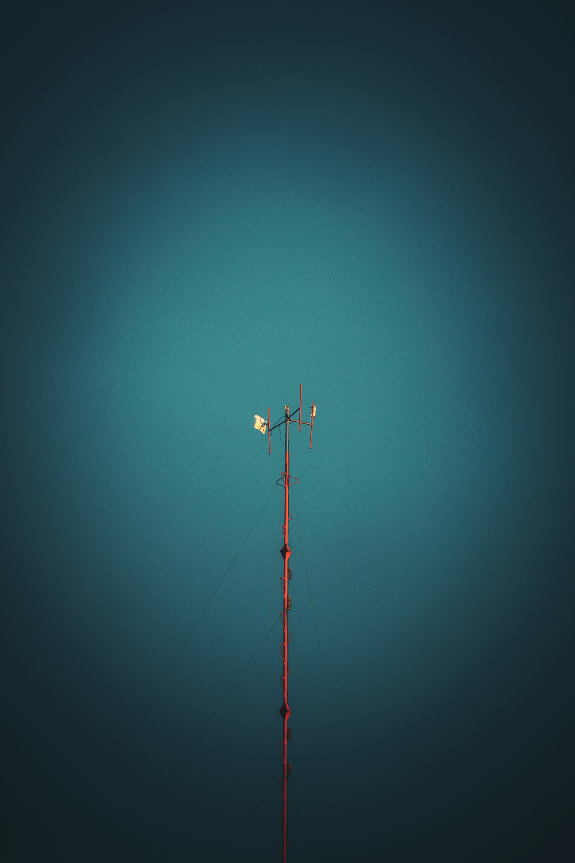 black and red metal pole under blue sky