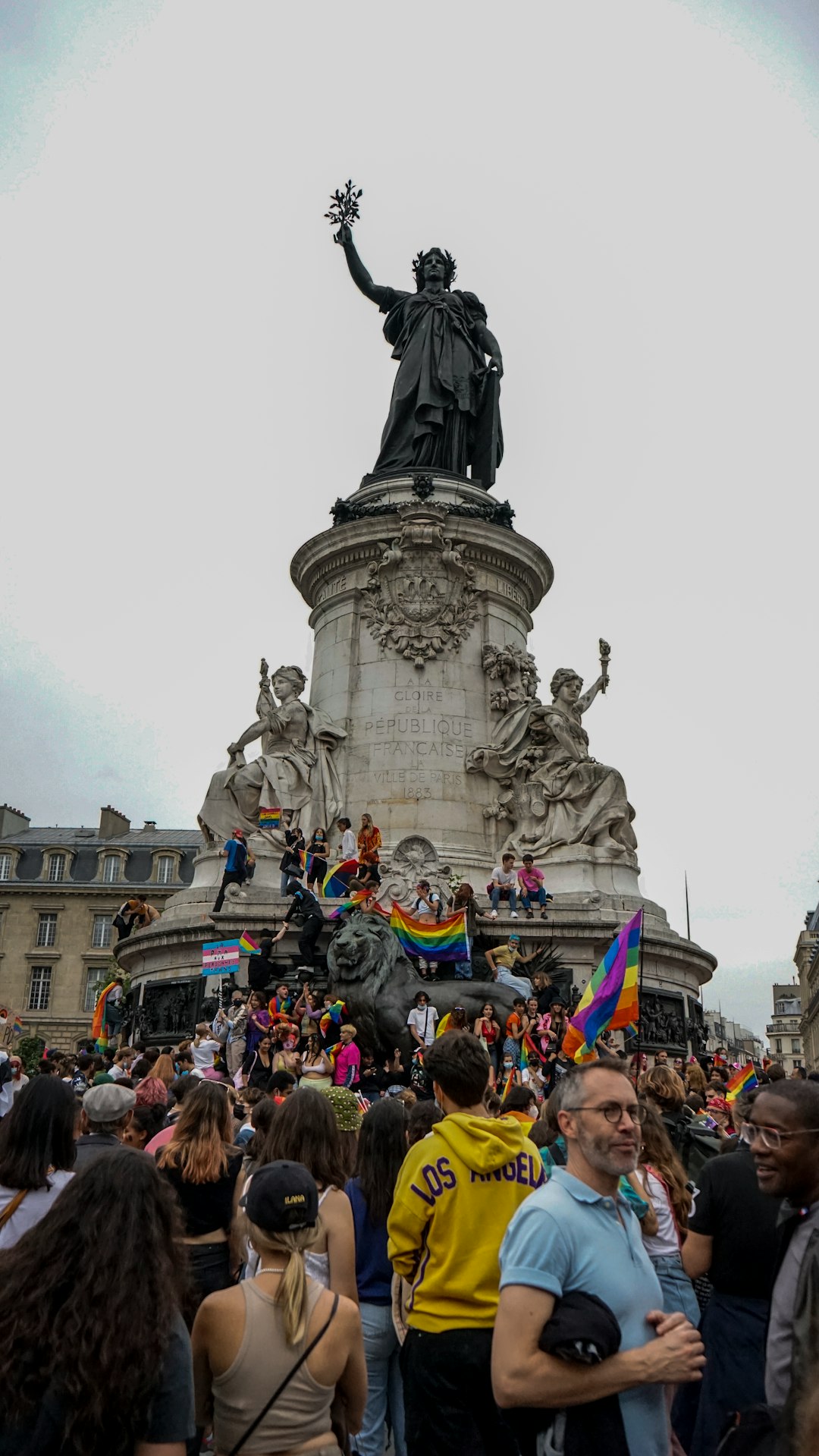 people gathering near statue during daytime