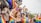 A vibrant event scene with people celebrating and having fun.