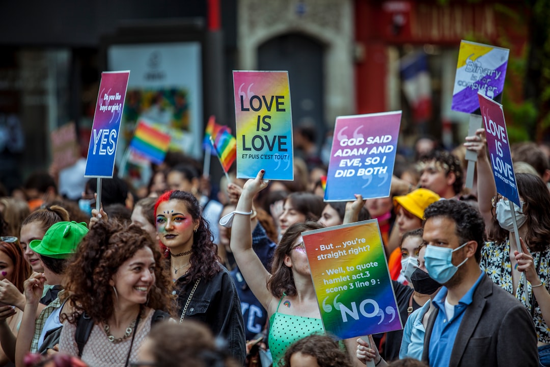 people holding happy birthday banner during daytime